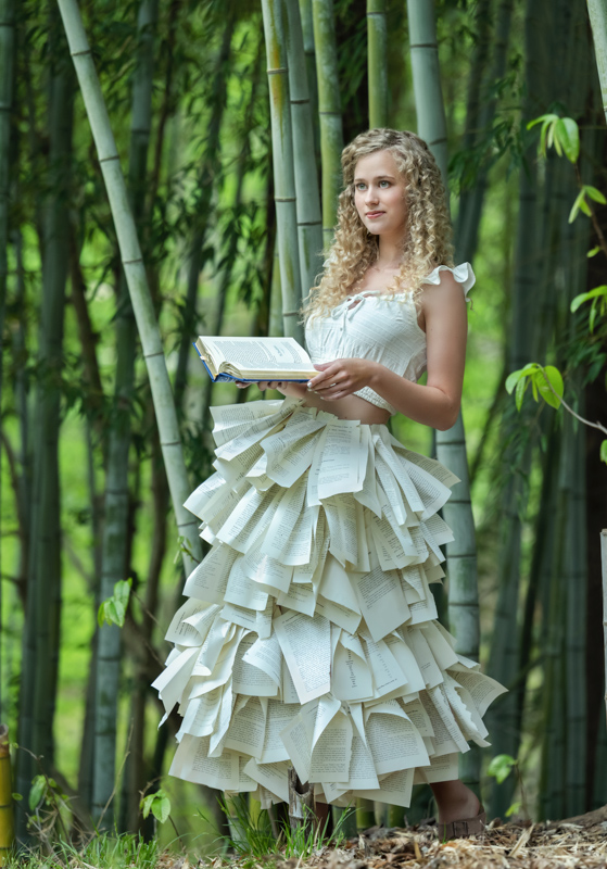 High school senior girl standing in bamboo grove with a book in her hands photographed by Marika H Photography in Williamsburg, VA